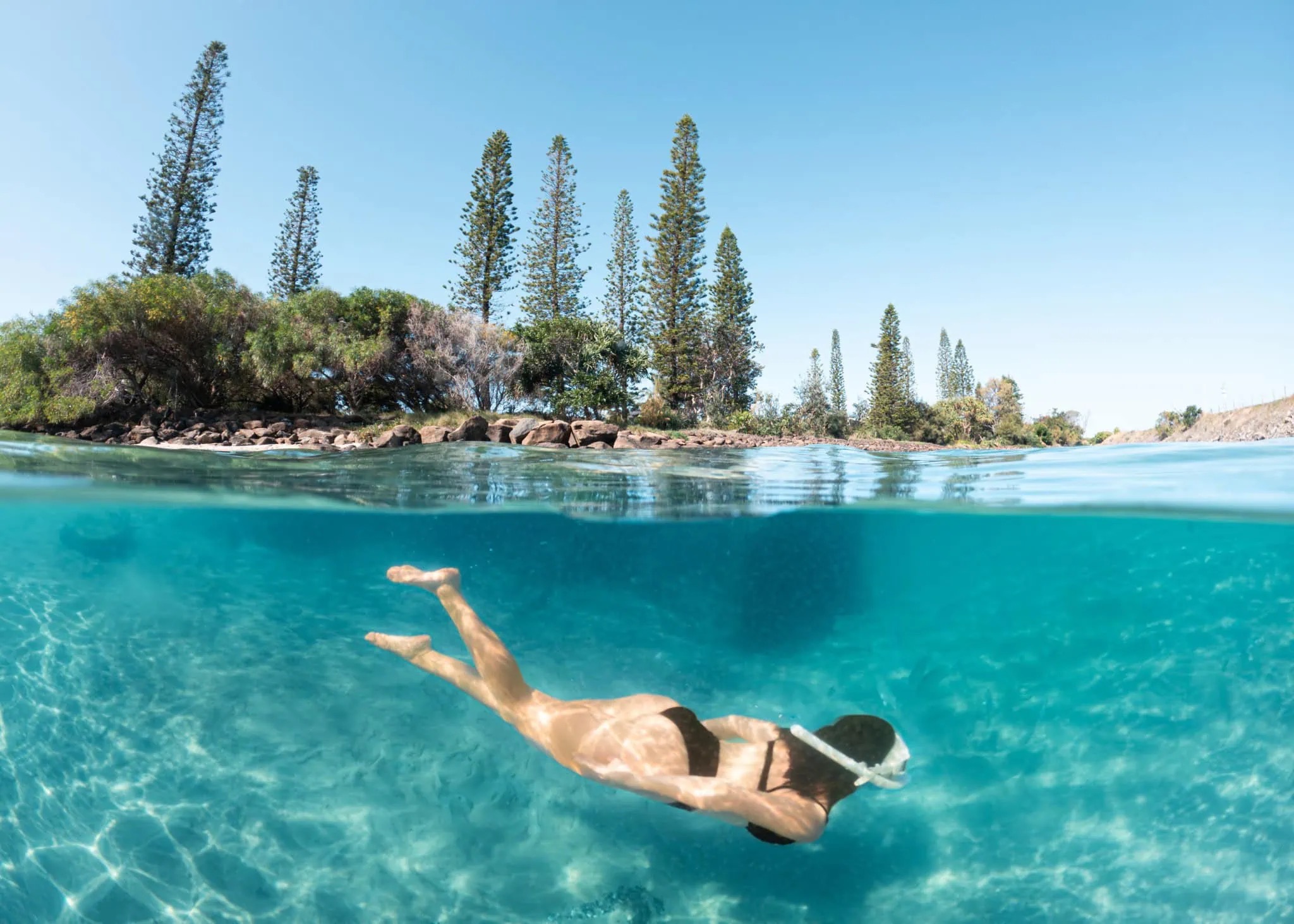 shaws-bay-water-activities Snorkeller swimming in the clear turquoise water at Shaws Bay in Ballina
